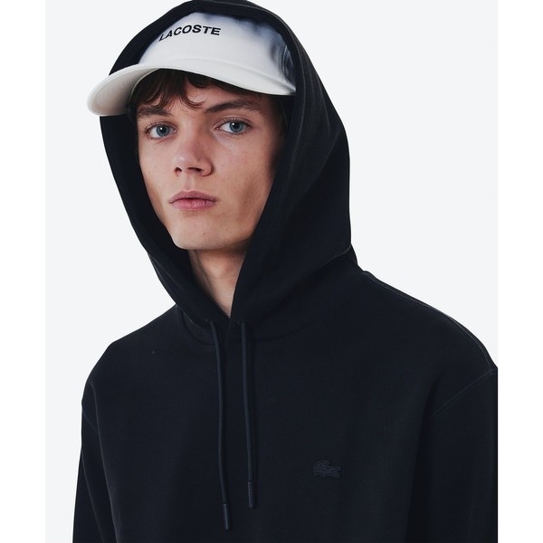 ヘリテージテニスロゴスウェットフーディー | ラコステ(LACOSTE