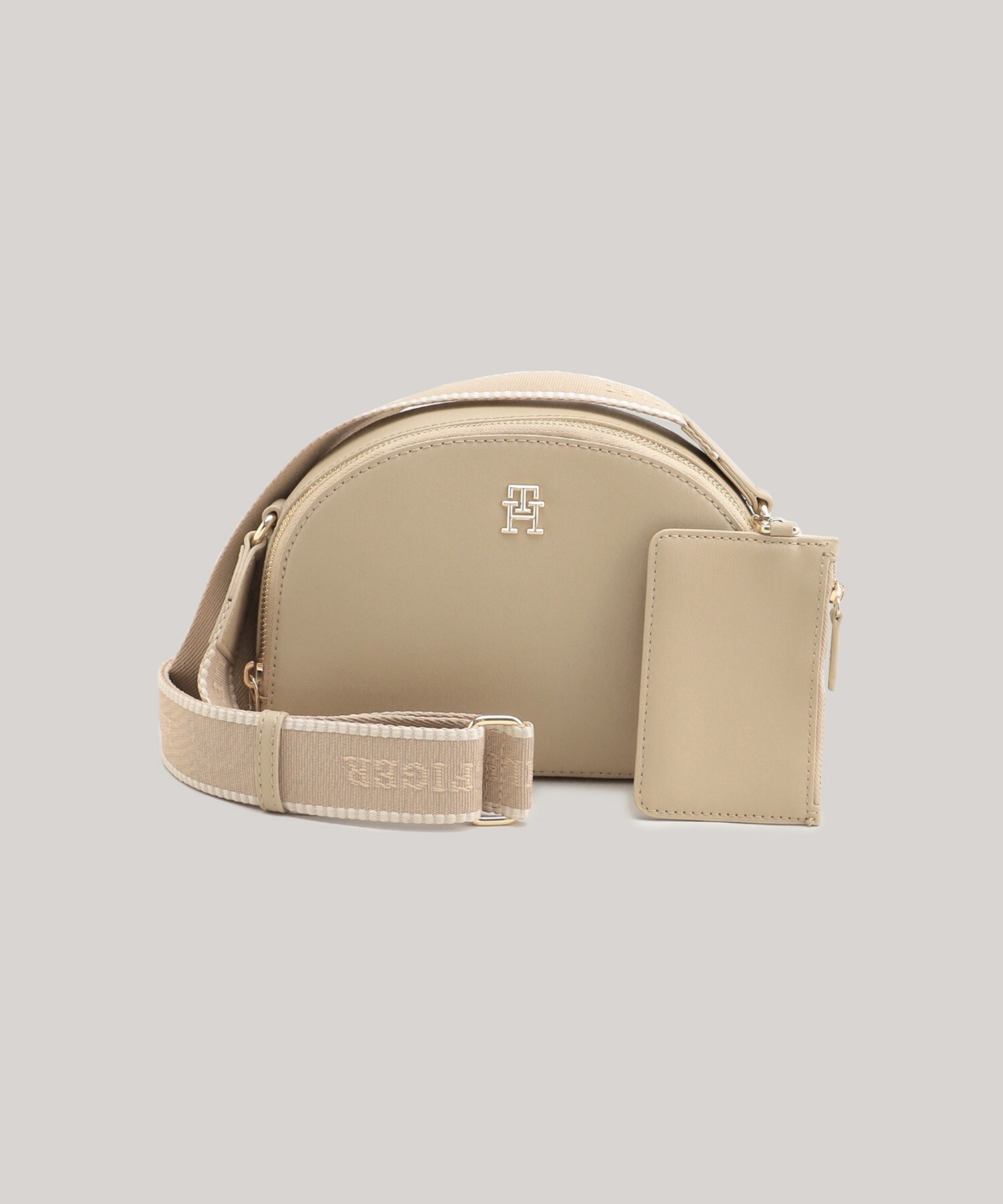 TOMMY HILFIGER｜モノタイプハーフムーンクロスボディバッグ