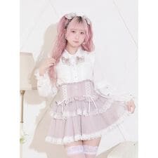 チャーム付きメニーリボンチュールブラウス