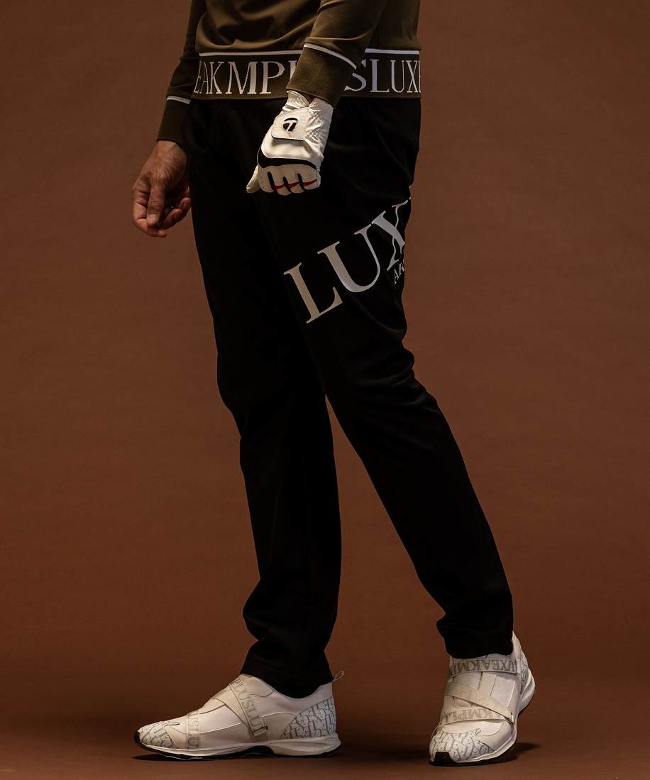 LUXEAKMPLUS ゴルフ ビッグロゴ防風ロングパンツ | リュクスエイケイ