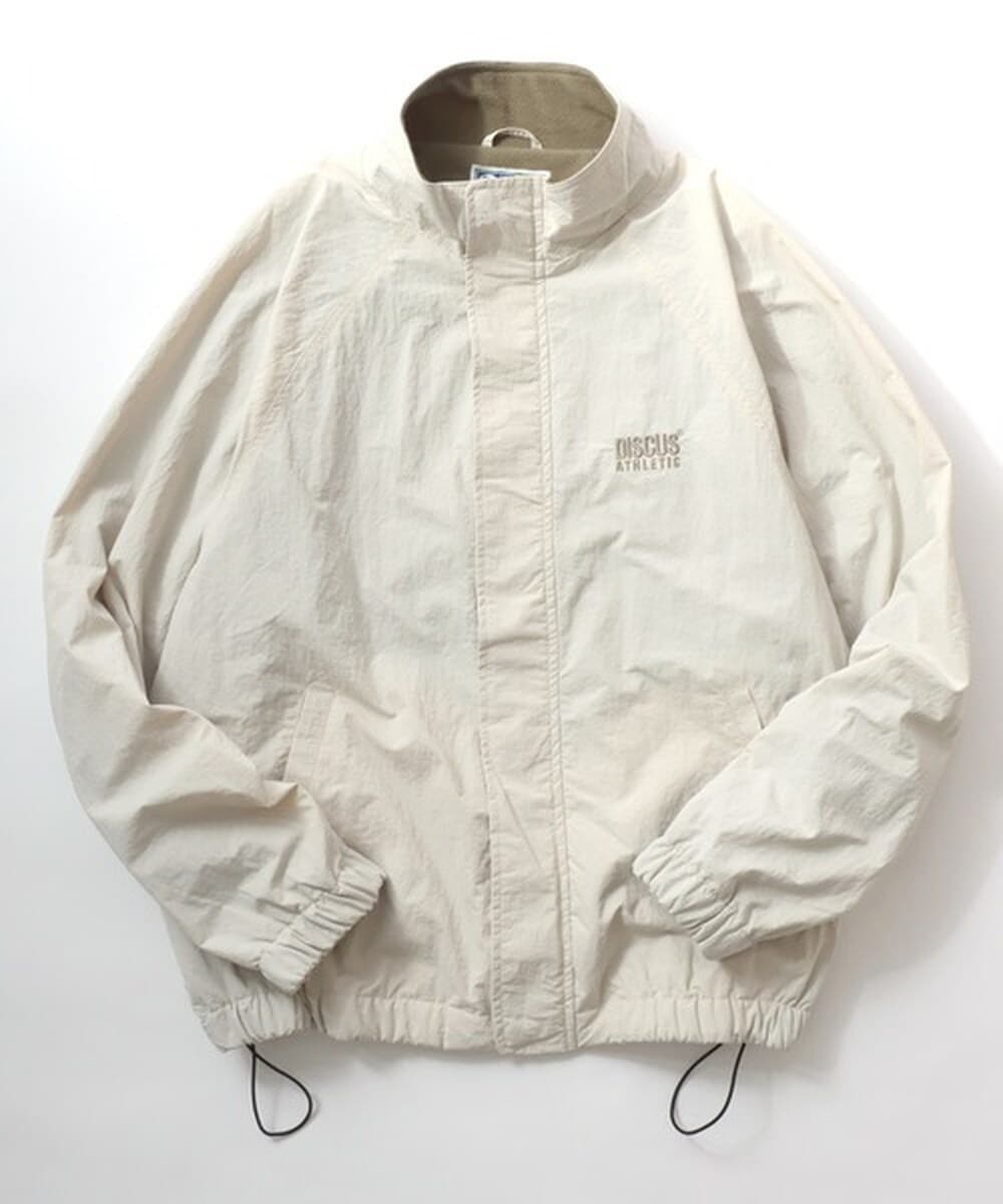 The unormwind＞刺繍ロゴワッシャーナイロンジップアップハイネック